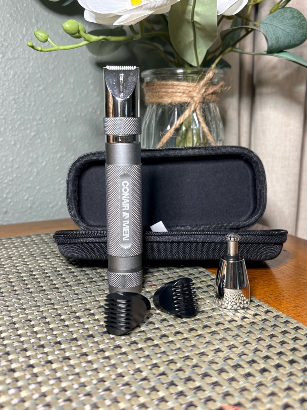 ConairMAN cordless grooming kit with attachments and storage case.